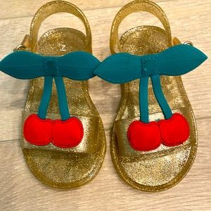 7T gold sparkle cherry sandals. Velcro straps. Excellent condition.